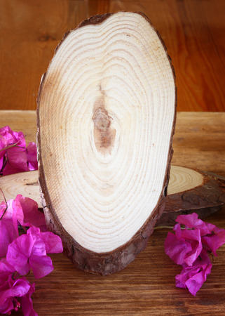 wood logs and flowers over wooden table  filtered image の写真素材
