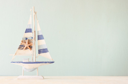 decorative boat over wooden textured background  の写真素材