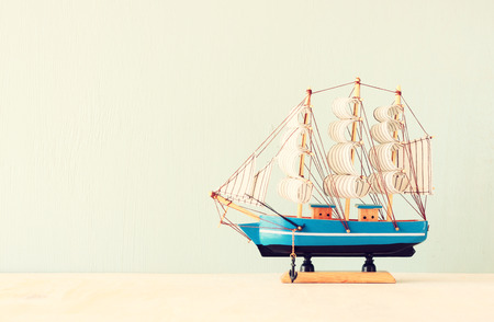 decorative boat over wooden textured background  の写真素材