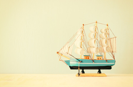 decorative boat over wooden textured background  の写真素材
