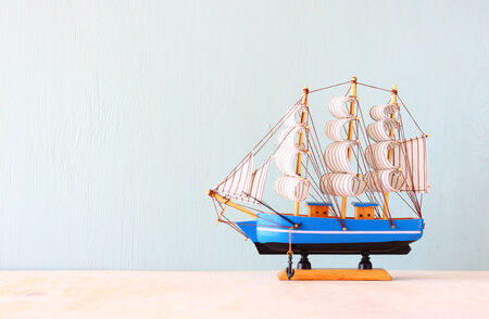 decorative boat over wooden textured background  の写真素材