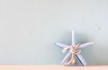 starfish over wooden textured background  の写真素材
