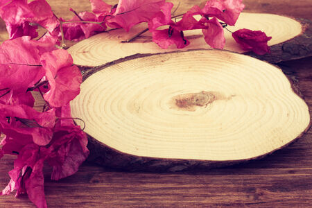 wood logs and flowers over wooden table  filtered image の写真素材