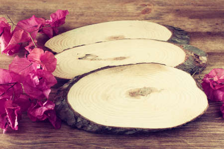 wood logs and flowers over wooden table  filtered image の写真素材