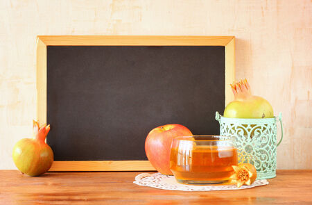empty blackboard, apple, honey and pomegranate  rosh hshanah concept の写真素材