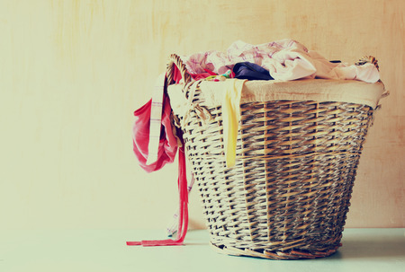 laundry basket full with clothes の写真素材