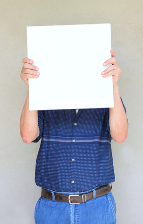 close up of elder man holding blank canvas  room for text   の写真素材