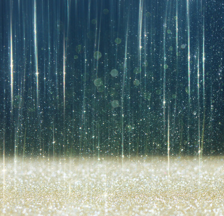 glitter vintage lights background  light gold and black  defocusedの写真素材