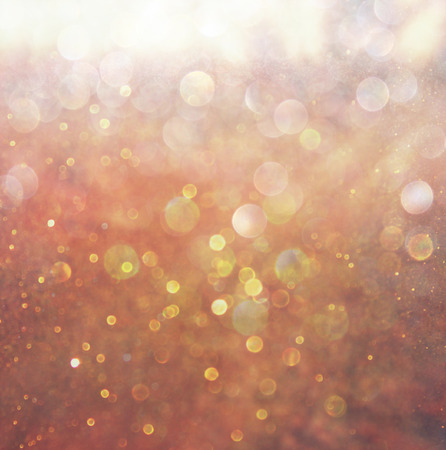 gold and warm abstract bokeh lights  defocused background  の写真素材
