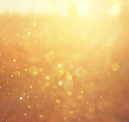 gold and warm abstract bokeh lights  defocused background  の写真素材