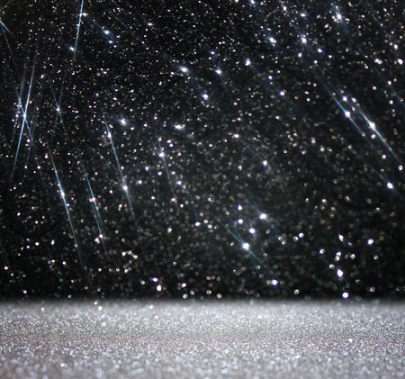 glitter vintage lights background  abstract white and black background  defocusedの写真素材