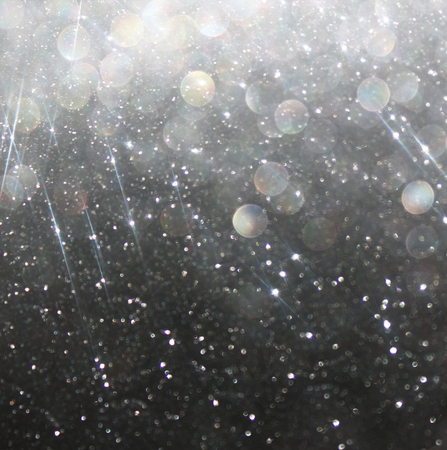 glitter vintage lights background  abstract white and black background  defocusedの写真素材