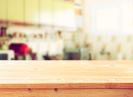 empty table board and defocused retro kitchen backgroundの写真素材