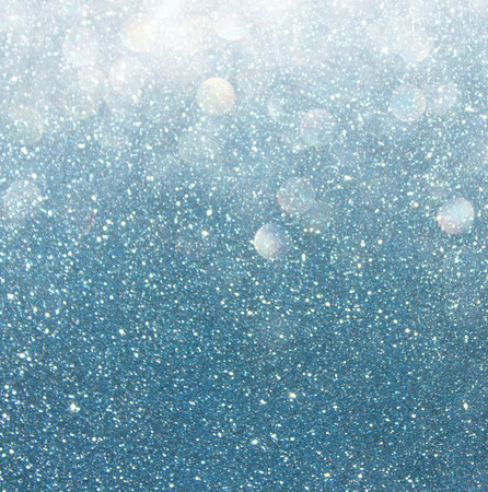 bokeh lights background with multi layers and colors of white silver and blueの写真素材