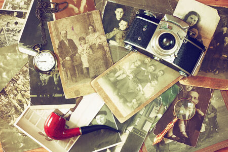 top view of old camera, antique photographs and old pocket clockの写真素材