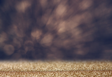Glitter vintage lights background. light gold and black. defocused.