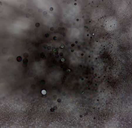dark glitter vintage lights background. light silver and black. defocused.の写真素材