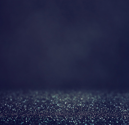 glitter vintage lights background. light silver and black. defocused.の写真素材