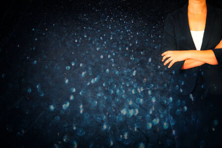 abstract picture of woman in business suit on black glitter background. filtered imageの写真素材