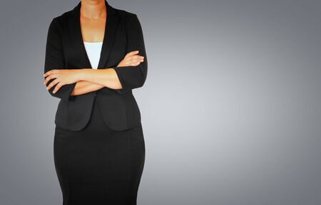 woman in business suit on gray elegant backgroundの写真素材