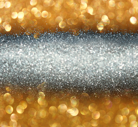 glitter vintage lights background. light gold and black. defocused.の写真素材
