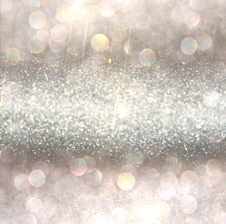 silver and white bokeh lights defocused. abstract backgroundの写真素材