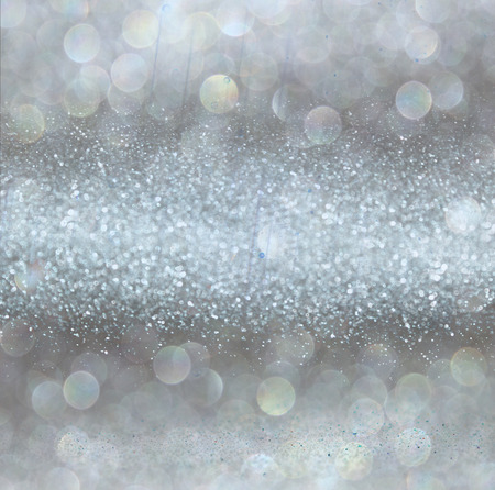 silver and white bokeh lights defocused. abstract backgroundの写真素材