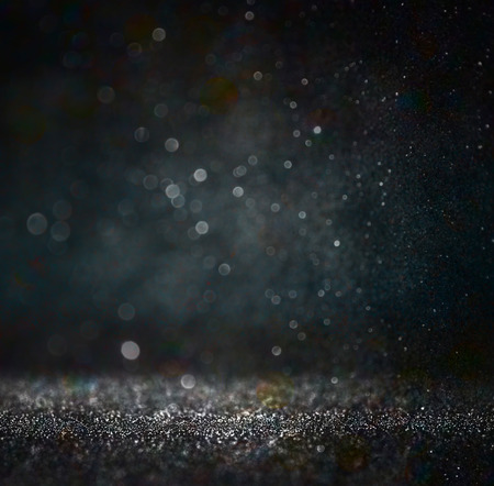 glitter vintage lights background. gold, silver, blue and black. de-focused.の写真素材