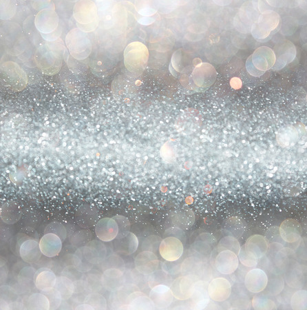 silver and white bokeh lights defocused. abstract backgroundの写真素材