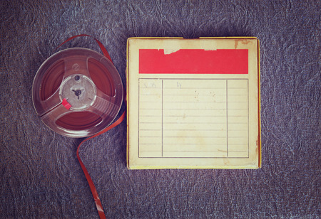 top view of  old sound recording tape, reel to reel type and box with room for text. filtered imageの写真素材