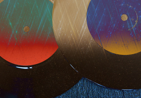 top view of record over textured background and glitter lightsの写真素材