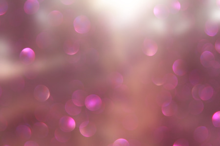 abstract photo of light burst among trees and glitter bokeh lights. image is blurred and filtered .の写真素材