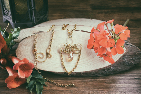 antique vintage necklace on wooden table. retro filtered imageの写真素材