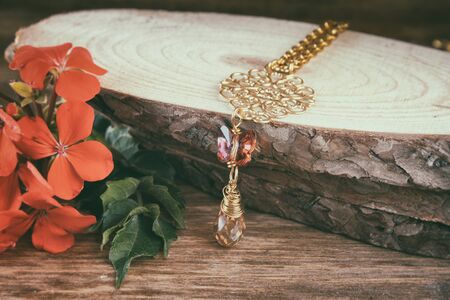 antique vintage necklace on wooden table. retro filtered imageの写真素材