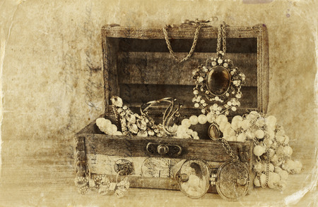A collection of vintage jewelry in antique wooden jewelry box. の写真素材