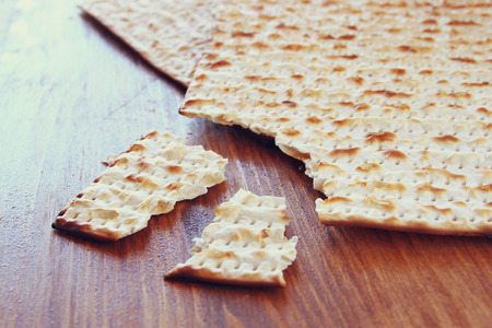 Passover background.matzoh (jewish passover bread) over wooden background.の写真素材