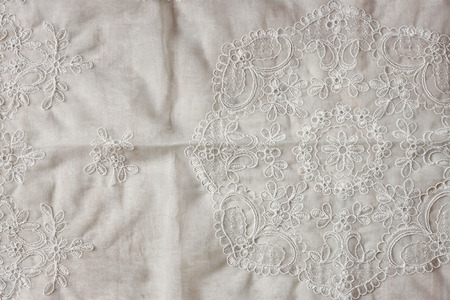 top view of vintage hand made beautiful lace fabric over wooden tableの写真素材
