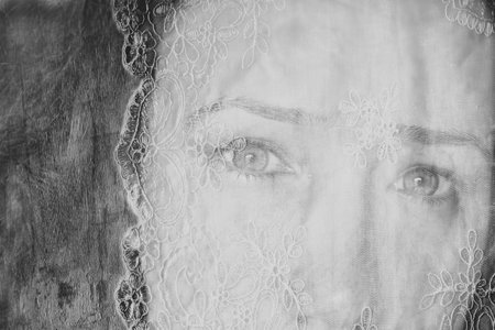 double exposure image of young girl and vintage lace background. black and white photoの写真素材