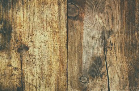 image of textured wooden board with grain and scratches. image is retro style filtered with faded effectの写真素材