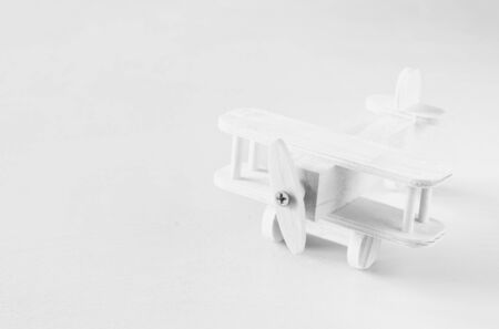 wooden airplane toy over textured wooden background. retro style imageの写真素材