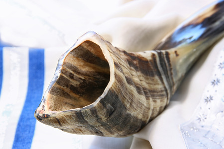 shofar horn on white prayer talit. room for text. rosh hashanah jewish holiday concept . traditional holiday symbol.の写真素材