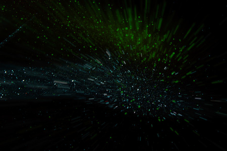 glitter vintage lights background. gold, green, blue and black. de-focused.