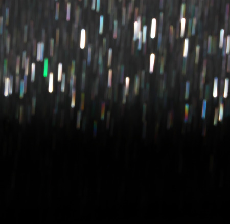glitter vintage lights background. light silver, blue and black. defocused.