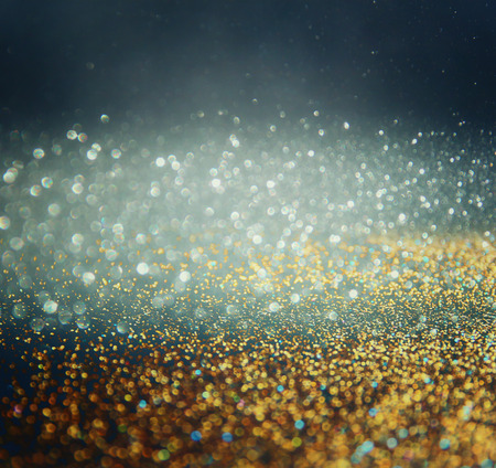 glitter vintage lights background. gold, blue and black. defocusedの写真素材