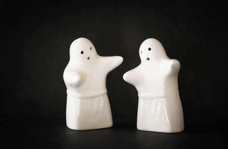 Set of two halloween ghosts and black backgroundの写真素材