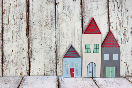 image of vintage wooden colorful houses decoration on wooden table.