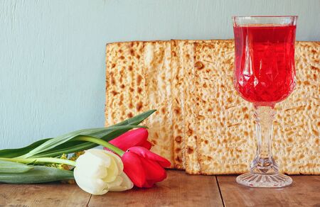 Pesah celebration concept (jewish Passover holiday) with wine and traditional plateの写真素材