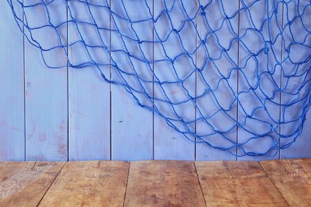 wooden table in front of blue wooden background. product display backgroundの写真素材