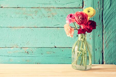 photo of spring flowers on wooden background. vintage filtered.の写真素材