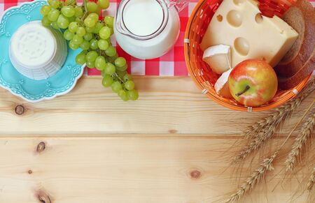 image of dairy products and fruits on wooden background.の写真素材